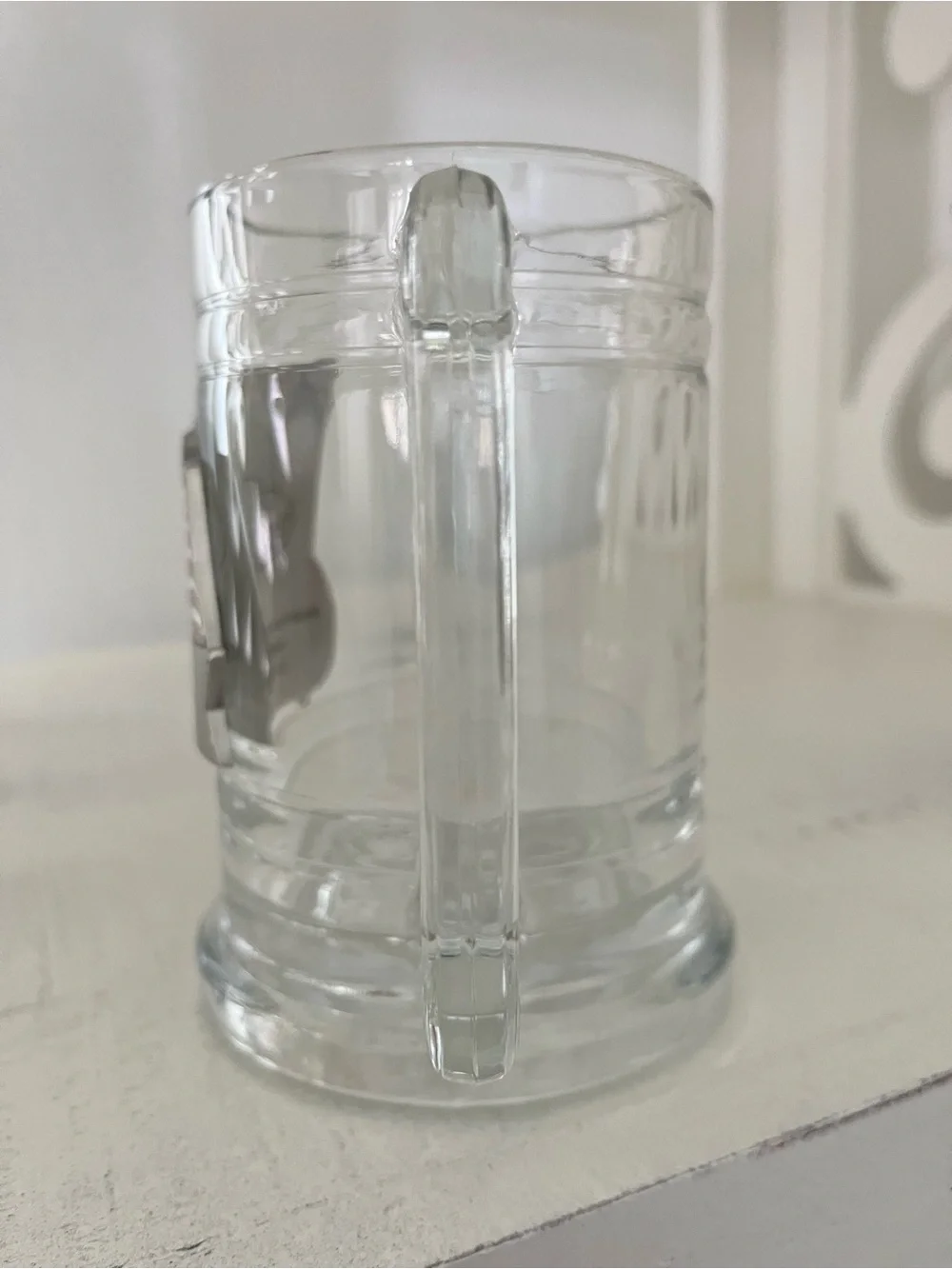 Glass beer stein with an applied pewter American flag emblem